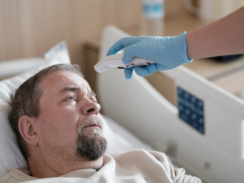 Hospitalized patient recovering from surgery, situation often reviewed by a surgical error attorney.