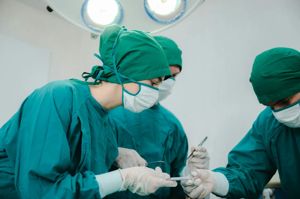 Surgeons in operating room performing procedure