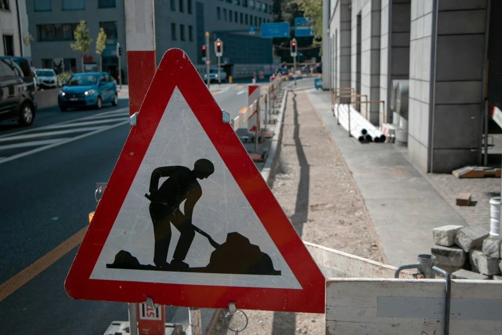 Construction warning sign on city street