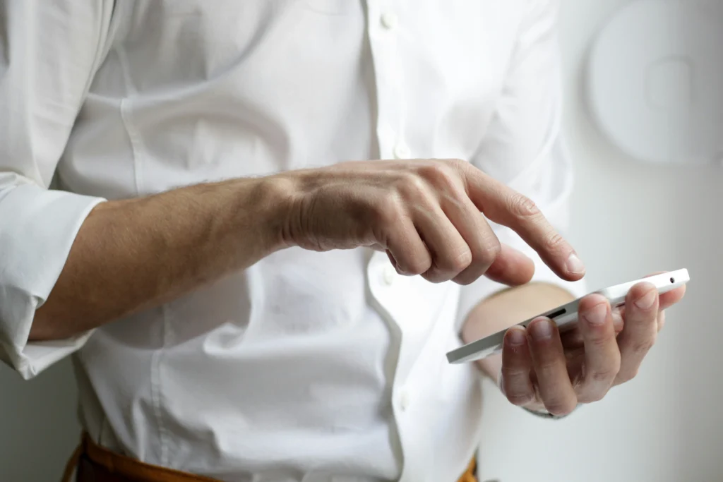 man touching a phone 
