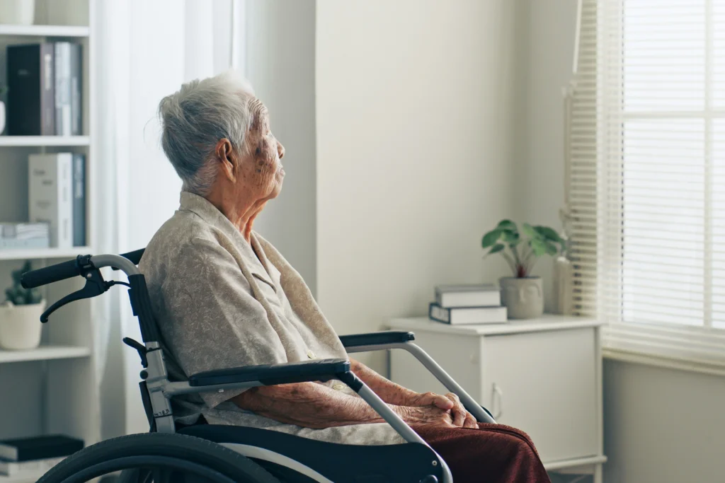 Neglected nursing home resident staring at window