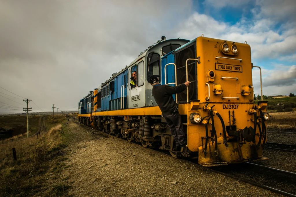 Train conductor climbing locomotive during work covered by FELA railroad law protections