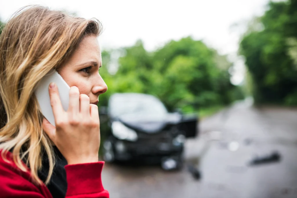 Woman calling Illinois Lawyer for a Rockford Illinois car accident lawyer after a car crash